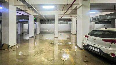 The explosion at Triveni Heights, located in Sector 16B, was reported around 7.15pm on October 5, leaving several cars and portions of the basement severely damaged. (HT Photo) The explosion at Triveni Heights, located in Sector 16B, was reported around 7.15pm on October 5, leaving several cars and portions of the basement severely damaged. (HT Photo)