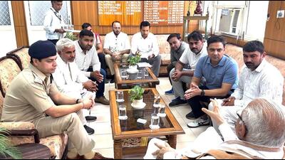 Union minister and former Haryana chief minister Manohar Lal Khattar interacting with relatives of late ASI Sandeep Lathar in Rohtak on Thursday. (HT Photo) Union minister and former Haryana chief minister Manohar Lal Khattar interacting with relatives of late ASI Sandeep Lathar in Rohtak on Thursday. (HT Photo)
