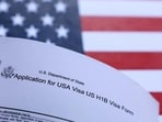 A US flag and US H-1B visa application form are seen in this illustration taken on September 26, 2025. (REUTERS) A US flag and US H-1B visa application form are seen in this illustration taken on September 26, 2025. (REUTERS)