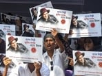 All Assam Students' Union (AASU) members hold posters during a protest demanding justice for late music icon Zubeen Garg.