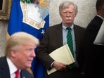 John Bolton stands alongside US President Donald Trump as he speaks in 2018 John Bolton stands alongside US President Donald Trump as he speaks in 2018