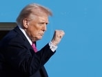 President Donald Trump gestures from the stairs of Air Force One as he boards upon his arrival at Joint Base Andrews President Donald Trump gestures from the stairs of Air Force One as he boards upon his arrival at Joint Base Andrews
