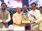 Uttar Pradesh chief minister Yogi Adityanath at the scholarship distribution programme in Lucknow on Friday. (HT)