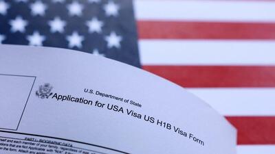 A US flag and US H-1B visa application form are seen in this illustration taken on September 26, 2025. (REUTERS) A US flag and US H-1B visa application form are seen in this illustration taken on September 26, 2025. (REUTERS)