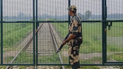 A security personnel stands guard near the India-Bangladesh border. (PTI) A security personnel stands guard near the India-Bangladesh border. (PTI)