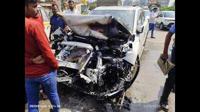 After the accident, the bonnet of the high-end SUV in which they were traveling was damaged and caught fire. (HT PHOTO)