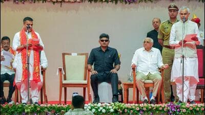 Gujarat Governor Acharya Devvrat administers the oath to Gujarat Deputy Chief Minister Harsh Sanghavi during the swearing-in ceremony of the new Gujarat cabinet, in Gandhinagar on Friday. (ANI)