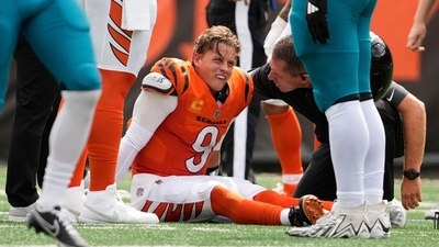 Cincinnati Bengals quarterback Joe Burrow (9) grimaces aft being sacked by Jacksonville Jaguars defensive tackle Arik Armstead (91) (AP) Cincinnati Bengals quarterback Joe Burrow (9) grimaces aft being sacked by Jacksonville Jaguars defensive tackle Arik Armstead (91) (AP)