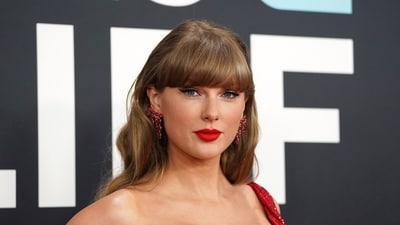 A clip from Taylor Swift's Eras Tour documentary went viral as a post claimed she wore a $22.5k Cartier necklace while working out. (Photo by Jordan Strauss/Invision/AP, File) (Jordan Strauss/Invision/AP) A clip from Taylor Swift's Eras Tour documentary went viral as a post claimed she wore a $22.5k Cartier necklace while working out. (Photo by Jordan Strauss/Invision/AP, File) (Jordan Strauss/Invision/AP)