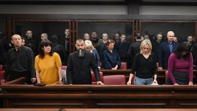 Lawyers of Ukrainian soldiers of the Aidar battalion captured by Russia during fighting in Ukraine stand in front of the defendants' cage during a hearing at the Southern District Military Court in Rostov-on-Don. (AP Photo) (AP) Lawyers of Ukrainian soldiers of the Aidar battalion captured by Russia during fighting in Ukraine stand in front of the defendants' cage during a hearing at the Southern District Military Court in Rostov-on-Don. (AP Photo) (AP)