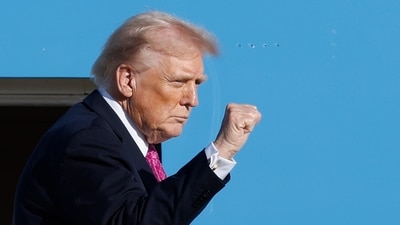 President Donald Trump gestures from the stairs of Air Force One as he boards upon his arrival at Joint Base Andrews (AP) President Donald Trump gestures from the stairs of Air Force One as he boards upon his arrival at Joint Base Andrews (AP)