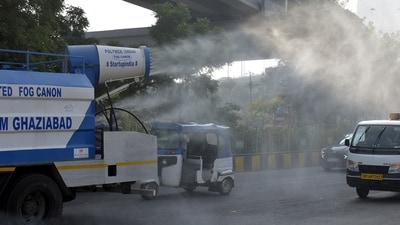 In view of rising pollution levels across Delhi-NCR, the Ghaziabad Municipal Corporation deployed an anti-smog water cannon to spray water on roads in the Indirapuram area to curb dust and improve air quality. (Sakib Ali / Hindustan Times)