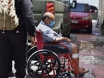 Fugitive diamantaire Mehul Choksi being taken in a wheelchair to a court by police after his arrest, in Roseau, Dominica, on June 4, 2021. 