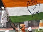 A Congress supporter waves the party flag in Patna, Bihar. A Congress supporter waves the party flag in Patna, Bihar.