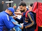 India's Virat Kohli signs autographs for fans