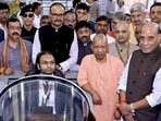 Defence minister Rajnath Singh, UP CM Yogi Adityanath and DyCM Brajesh Pathak with others during the flagging off ceremony of the first batch of BrahMos missiles manufactured at the BrahMos Aerospace unit at Sarojini Nagar, in Lucknow on Saturday. (PTI)