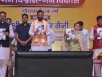 Haryana chief minister Nayab Singh Saini releasing a coffee table book during the state-level function that was held to mark the completion of one year of the BJP government in the state on Friday. (Sant Arora/Hindustan Times) Haryana chief minister Nayab Singh Saini releasing a coffee table book during the state-level function that was held to mark the completion of one year of the BJP government in the state on Friday. (Sant Arora/Hindustan Times)