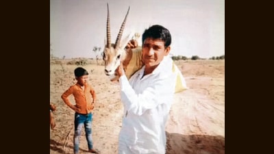 Godara carries wounded Chinkara on his shoulder. (Gopi Ram Saran) Godara carries wounded Chinkara on his shoulder. (Gopi Ram Saran)