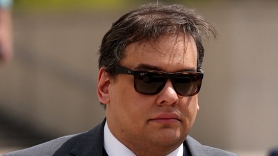 Santos had been sentenced in April after he admitted to deceiving donors and stealing the identities of 11 people to donate to his campaign. (REUTERS)