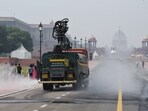 Smog Gun sprays water to control pollution levels as Air Quality dropped to poor category near Rashtrapati Bhawan, in New Delhi on Sunday. (ANI Photo/ Sumit) Smog Gun sprays water to control pollution levels as Air Quality dropped to poor category near Rashtrapati Bhawan, in New Delhi on Sunday. (ANI Photo/ Sumit)
