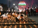 Gram it: Rows of diyas on Kartavya Path give a never seen before sheen to India Gate. Several volunteers lit up these as part of Delhi government's Diwali celebrations over the weekend. Delhiites, how about joining them today evening? (Photo: Deepanshu Aggarwal/AP)