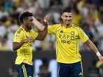 Cristiano Ronaldo and Kingsley Coman celebrate during Al Nassr's big win.