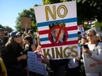 A demonstrator holds a sign during the "No Kings" protest on October 18, 2025 in Portland, Oregon. Organizers expect millions to participate in cities and towns across the nation for the second "No Kings" protest to denounce the Trump administration. A demonstrator holds a sign during the "No Kings" protest on October 18, 2025 in Portland, Oregon. Organizers expect millions to participate in cities and towns across the nation for the second "No Kings" protest to denounce the Trump administration.