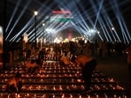 New Delhi: People light  diyas or earthen lamps along the Kartavya Path as at the India Gate on Saturday