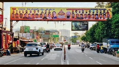 An illegal banner covering a directional board on Pakhowal road in Ludhiana. (Manish/HT) An illegal banner covering a directional board on Pakhowal road in Ludhiana. (Manish/HT)