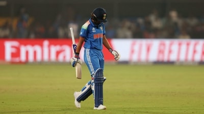 India's Harmanpreet Kaur walks after losing her wicket (REUTERS)