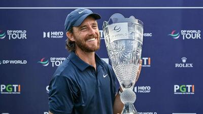 England's Tommy Fleetwood celebrates with the trophy after winning the DP World India Championship. (AFP) England's Tommy Fleetwood celebrates with the trophy after winning the DP World India Championship. (AFP)