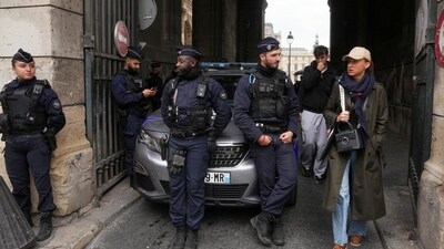 Police officers block an access to the Louvre museum after the robbery on Sunday. (AP) Police officers block an access to the Louvre museum after the robbery on Sunday. (AP)