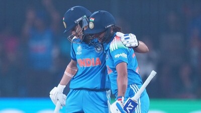 India's captain Harmanpreet Kaur, right, congratulated by Smriti Mandhana against England. (AP) India's captain Harmanpreet Kaur, right, congratulated by Smriti Mandhana against England. (AP)
