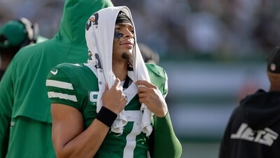 New York Jets quarterback Justin Fields (7) watches from the sidelines during the fourth quarter against the Carolina Panthers (AP) New York Jets quarterback Justin Fields (7) watches from the sidelines during the fourth quarter against the Carolina Panthers (AP)