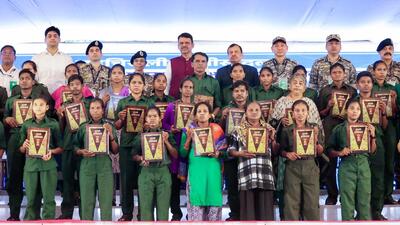 Maharashtra chief minister Devendra Fadnavis in a group photograph with Maoist members holding copies of the Constitution as they lay down their arms at the Gadchiroli Police Headquarters, in Gadchiroli on October 15. (CMO Maharashtra - X) Maharashtra chief minister Devendra Fadnavis in a group photograph with Maoist members holding copies of the Constitution as they lay down their arms at the Gadchiroli Police Headquarters, in Gadchiroli on October 15. (CMO Maharashtra - X)