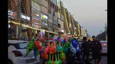 People shopping at the Sector-11 market in Panchkuka on Sunday. (Sant Arora/HT)