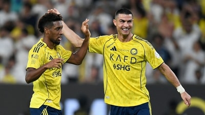 Cristiano Ronaldo and Kingsley Coman celebrate during Al Nassr's big win. (REUTERS)