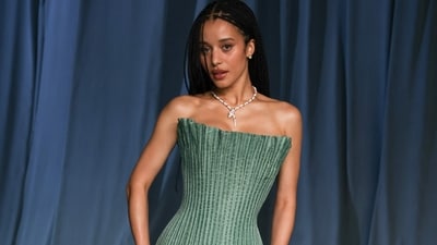 Chase Infiniti looks striking in a pastel mint green, pleated structural dress. She wore it to the Academy Museum Gala.&nbsp; (AFP)