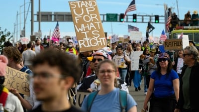 Demonstrators march over the Morrison Bridge during the "No Kings" protest on October 18, 2025 in Portland, Oregon. Organizers expect millions to participate in cities and towns across the nation for the second "No Kings" protest to denounce the Trump administration. Mathieu Lewis-Rolland/Getty Images/AFP (Photo by Mathieu Lewis-Rolland / GETTY IMAGES NORTH AMERICA / Getty Images via AFP) (Getty Images via AFP) Demonstrators march over the Morrison Bridge during the "No Kings" protest on October 18, 2025 in Portland, Oregon. Organizers expect millions to participate in cities and towns across the nation for the second "No Kings" protest to denounce the Trump administration. Mathieu Lewis-Rolland/Getty Images/AFP (Photo by Mathieu Lewis-Rolland / GETTY IMAGES NORTH AMERICA / Getty Images via AFP) (Getty Images via AFP)