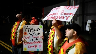 Anti-I.C.E. protesters in costumes stand hold signs near the U.S. Immigration and Customs Enforcement building on October 18, 2025 in Portland, Oregon. (Getty Images via AFP) Anti-I.C.E. protesters in costumes stand hold signs near the U.S. Immigration and Customs Enforcement building on October 18, 2025 in Portland, Oregon. (Getty Images via AFP)
