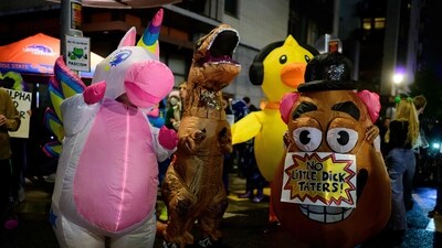 Anti-I.C.E. protesters dressed in inflatable costumes dance near the U.S. Immigration and Customs Enforcement building on October 18, 2025 in Portland, Oregon. (Getty Images via AFP) Anti-I.C.E. protesters dressed in inflatable costumes dance near the U.S. Immigration and Customs Enforcement building on October 18, 2025 in Portland, Oregon. (Getty Images via AFP)