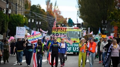 Demonstrators march through SE Portland during the "No Kings" protest on October 18, 2025 in Portland, Oregon. (Getty Images via AFP) Demonstrators march through SE Portland during the "No Kings" protest on October 18, 2025 in Portland, Oregon. (Getty Images via AFP)