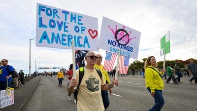 Demonstrators march over the Morrison Bridge during the "No Kings" protest on October 18, 2025 in Portland, Oregon. (Getty Images via AFP) Demonstrators march over the Morrison Bridge during the "No Kings" protest on October 18, 2025 in Portland, Oregon. (Getty Images via AFP)
