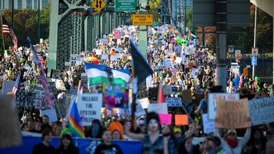 Demonstrators march over the Hawthorne Bridge during the "No Kings" protest on October 18, 2025 in Portland, Oregon. (Getty Images via AFP) Demonstrators march over the Hawthorne Bridge during the "No Kings" protest on October 18, 2025 in Portland, Oregon. (Getty Images via AFP)