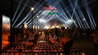 New Delhi: People light diyas or earthen lamps along the Kartavya Path as at the India Gate on Saturday (PTI) New Delhi: People light diyas or earthen lamps along the Kartavya Path as at the India Gate on Saturday (PTI)