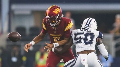 Dallas Cowboys linebacker Shemar James (50) forces a fumble by Washington Commanders quarterback Jayden Daniels (5) (AP) Dallas Cowboys linebacker Shemar James (50) forces a fumble by Washington Commanders quarterback Jayden Daniels (5) (AP)