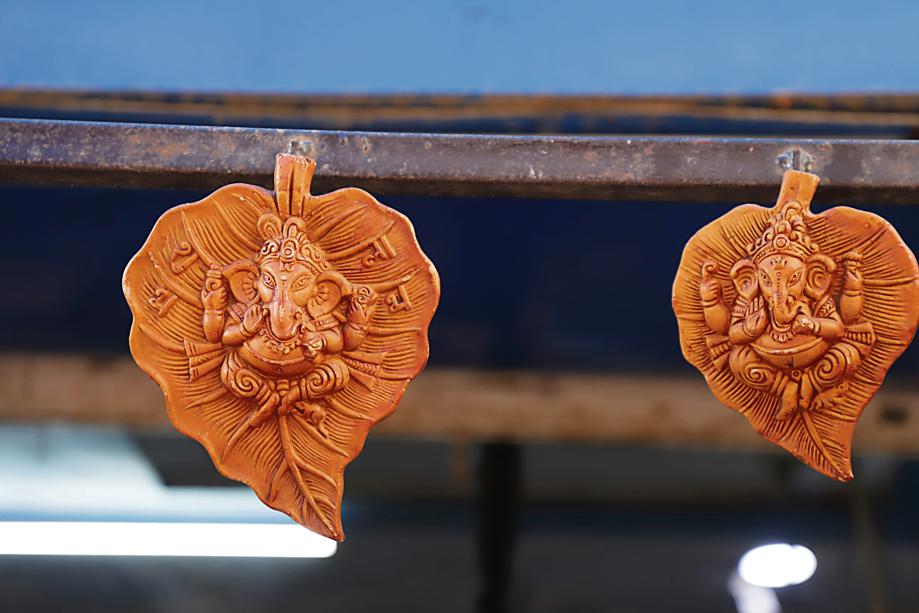 Leaf-shaped Ganesha wall hanging to blend artistry and spirituality in your home decor. Price: ₹60. Leaf-shaped Ganesha wall hanging to blend artistry and spirituality in your home decor. Price: ₹60.