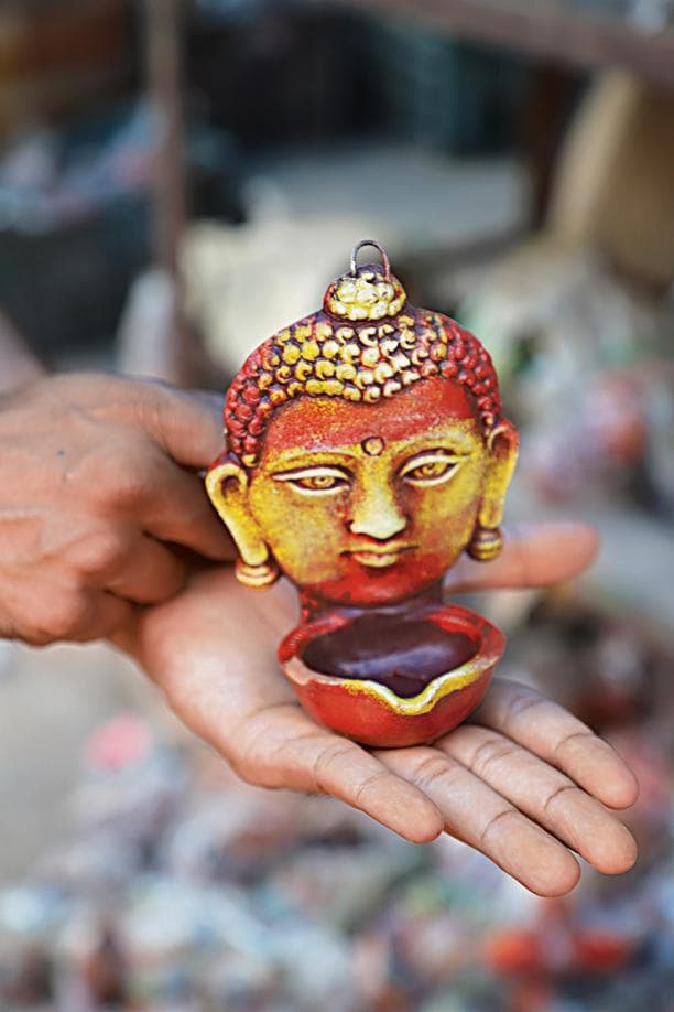 Buddha inspired diyas radiate calm and positivity. These can even double up as a wall hanging. Price: ₹50. Buddha inspired diyas radiate calm and positivity. These can even double up as a wall hanging. Price: ₹50.