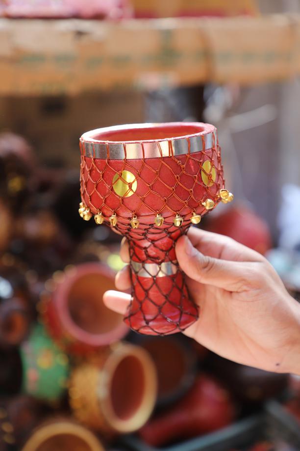 Clay chillum holders, adorned with tiny bells, will add a touch of charm to the festive flair. Price: ₹70. Clay chillum holders, adorned with tiny bells, will add a touch of charm to the festive flair. Price: ₹70.