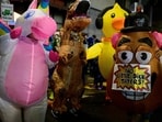 Anti-I.C.E. protesters dressed in inflatable costumes dance near the U.S. Immigration and Customs Enforcement building on October 18, 2025 in Portland, Oregon (Photo by Mathieu Lewis-Rolland / GETTY IMAGES NORTH AMERICA / Getty Images via AFP) Anti-I.C.E. protesters dressed in inflatable costumes dance near the U.S. Immigration and Customs Enforcement building on October 18, 2025 in Portland, Oregon (Photo by Mathieu Lewis-Rolland / GETTY IMAGES NORTH AMERICA / Getty Images via AFP)